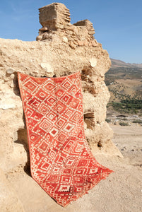 Authentic vintage Moroccan rug low pile cherry red with white colored tribal motifs