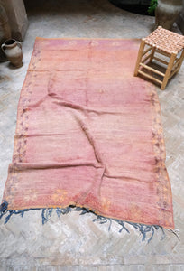 Handwoven vintage Moroccan rug with a beautiful palette of peach and pink