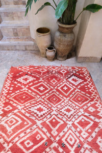 Authentic vintage Moroccan rug low pile cherry red with white colored tribal motifs