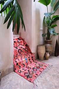Small pink Boujad Moroccan rug with abstract patterns