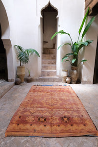 Low pile handwoven vintage Moroccan rug with a beautiful palette of terracotta and ochre