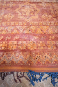 Low pile handwoven vintage Moroccan rug with a beautiful palette of terracotta and ochre