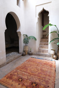 Low pile handwoven vintage Moroccan rug with a beautiful palette of terracotta and ochre