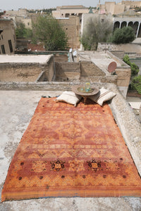 Low pile handwoven vintage Moroccan rug with a beautiful palette of terracotta and ochre