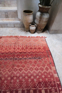 Authentic vintage Zemmour Moroccan rug in a rich raspberry color packed with many intricate motifs 