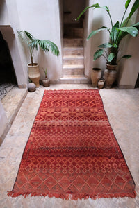 Authentic vintage Zemmour Moroccan rug in a rich raspberry color packed with many intricate motifs 